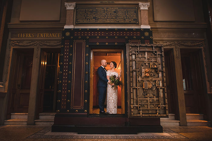 2019 Wedding couple poses in the bank vault at Weylin in NYC