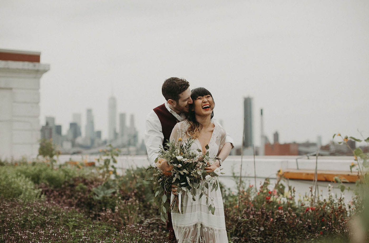 Weddig couple embracing each other at the BK Grange in the Brooklyn Navy Yard