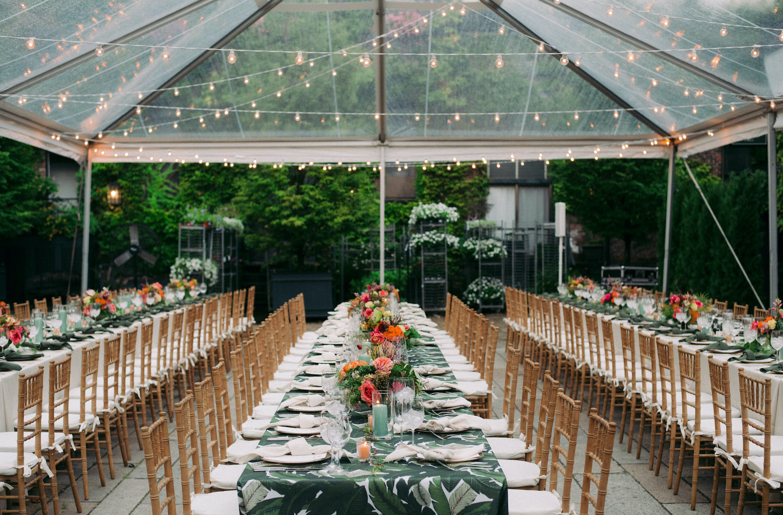 Tented tropical themed wedding reception table set up at The Foundry LIC
